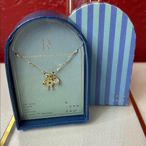 A New Day Gold Charm Necklace with Heart, R and Key